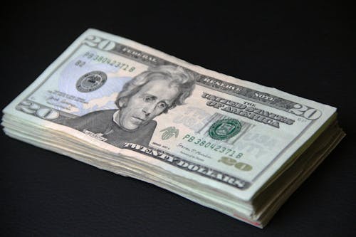 Ingyenes stockfotó amerikai dollár, bankjegyek, fekete háttér témában Stockfotó