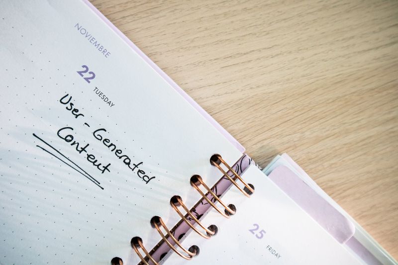 Open calendar with handwritten notes, used to plan a month of social posts