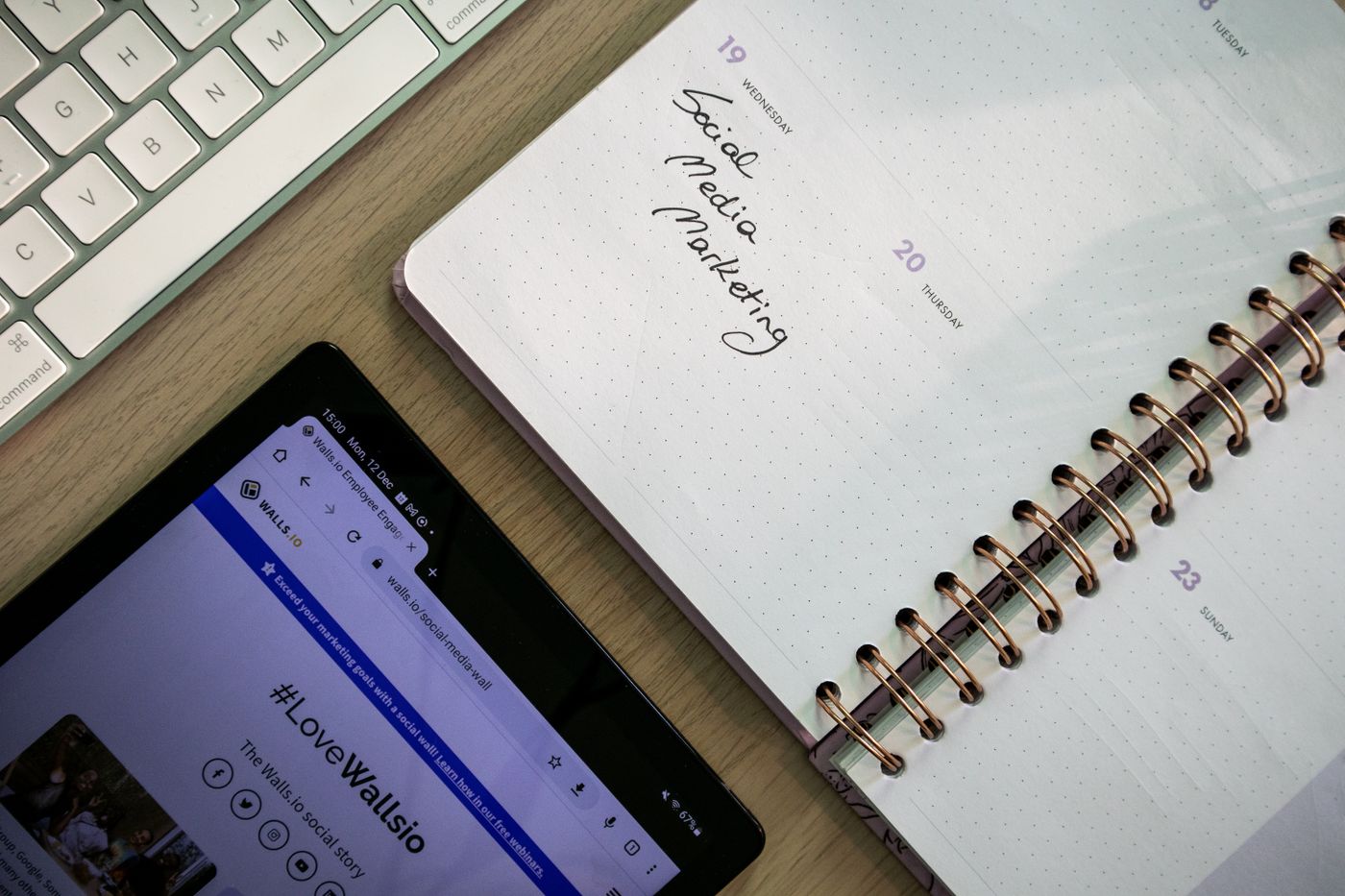 Landscape desk scene with a tablet and planner for choosing a strong lead magnet idea