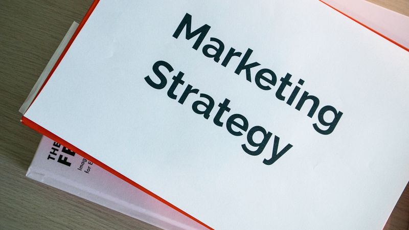 A marketing strategy document displayed on a desk, showcasing business planning essentials.