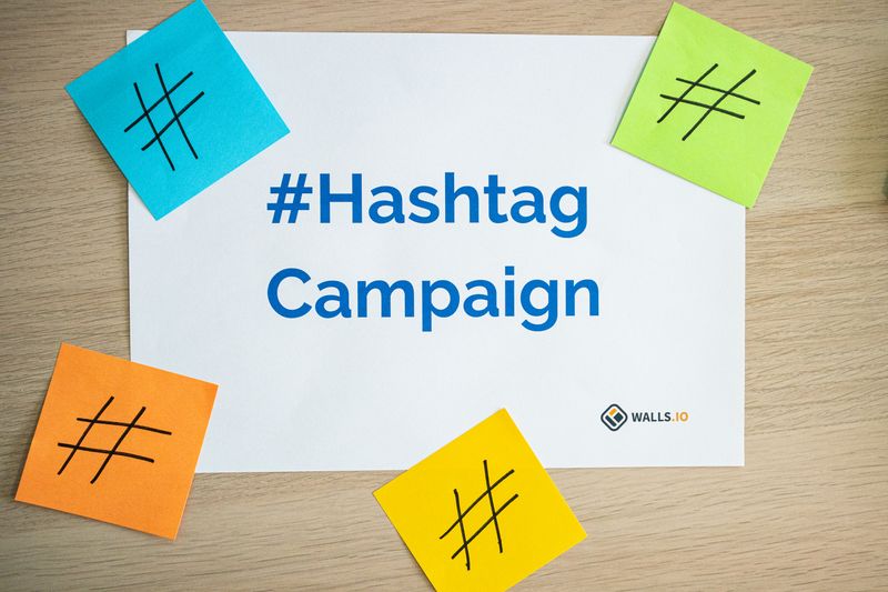 Colorful sticky notes arranged around a hashtag campaign sign, ideal for social media marketing concepts