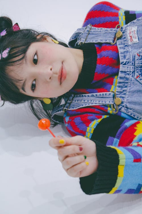 Woman Posing with Lollipop 