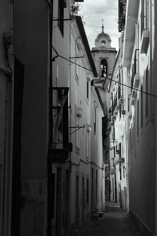 Narrow Alley in Town with Church behind