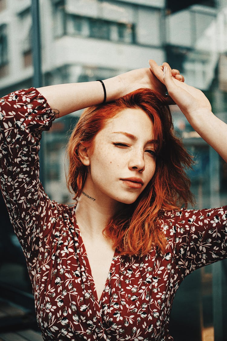 Young Woman Holding Hands On The Top Of The Head