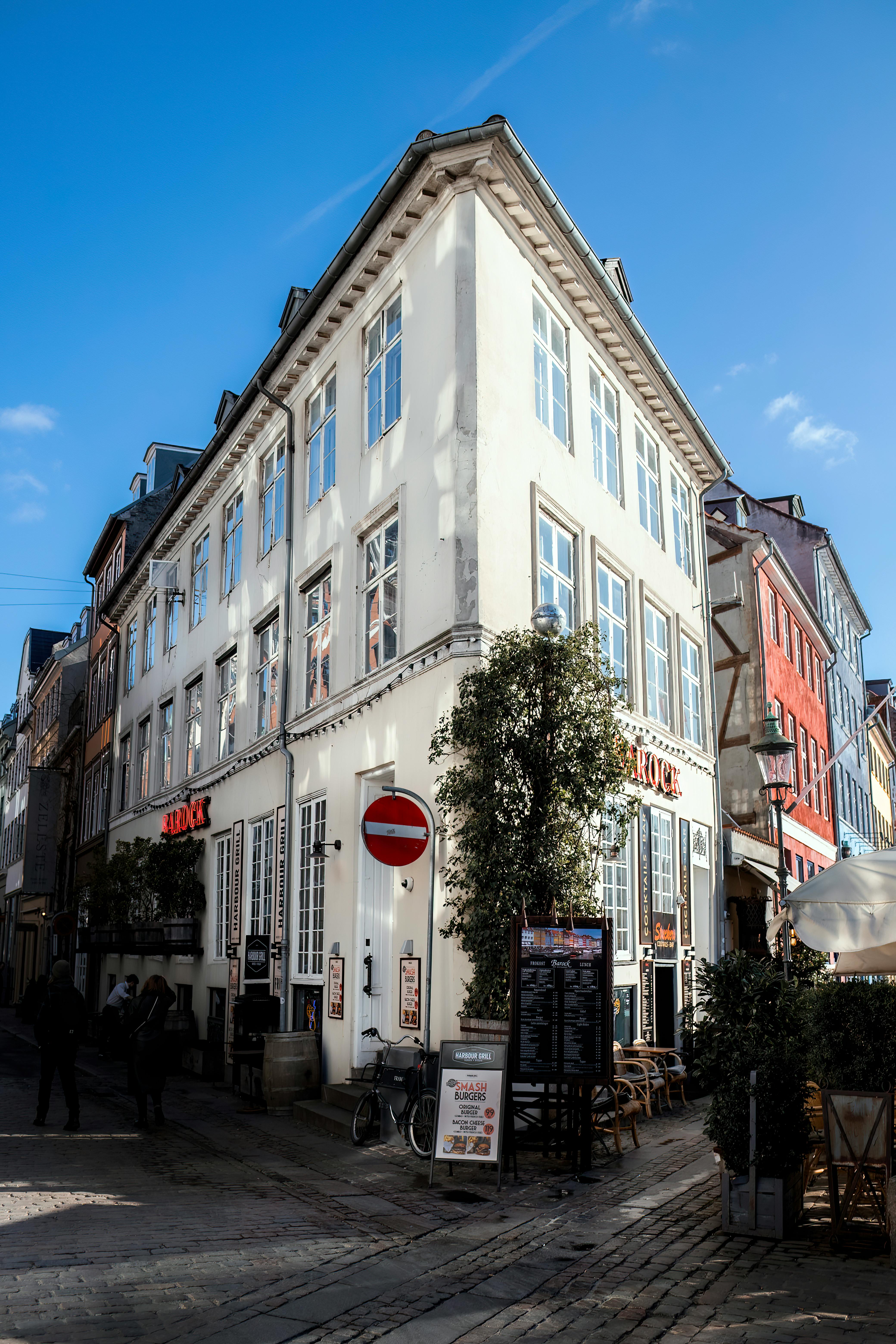 Free Corner of a historic building in Copenhagen showcasing classic architecture in bright daylight. Stock Photo