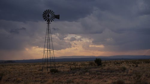 Scenic Landscape with a Windmill in the Desert