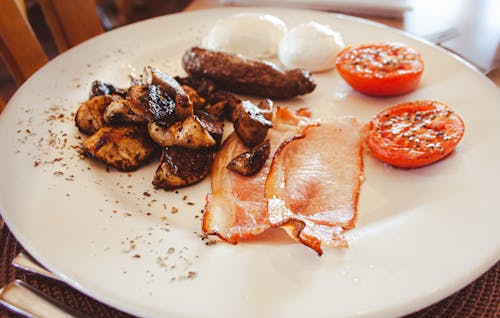 Photo of Breakfast with Bacon, Eggs and Tomatoes