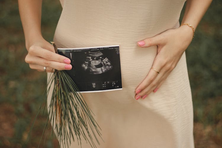 Close-up Of Pregnant Woman With Ultrasound Scan