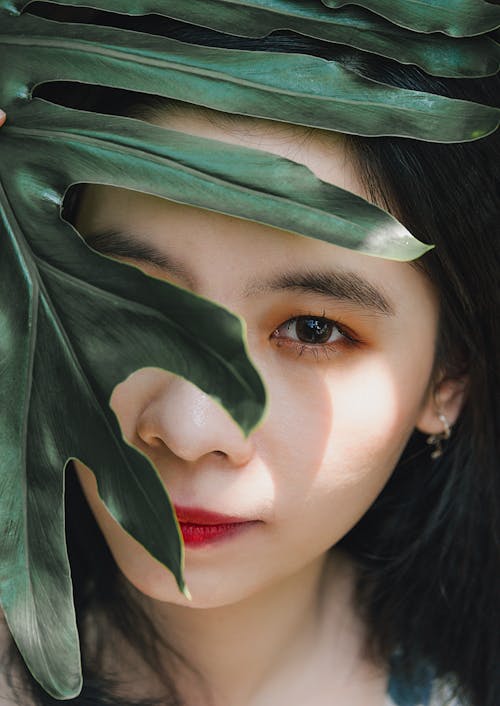 Woman Face Behind Leaf