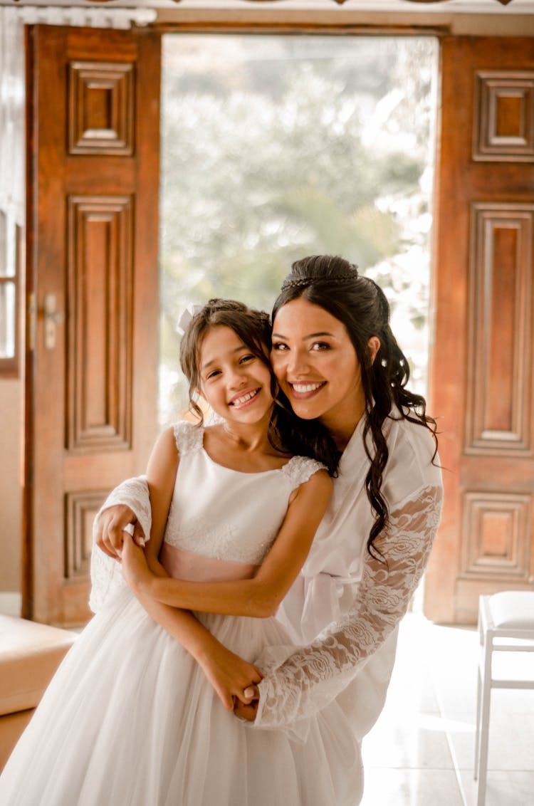 Smiling Bride Hugging Little Girl