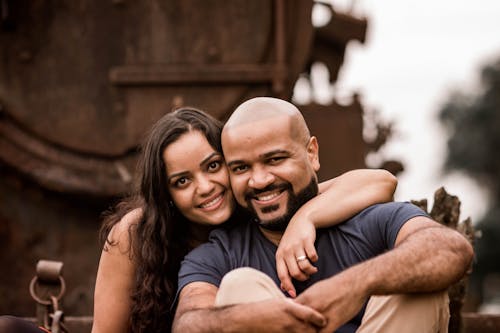 A Portrait of a Couple Smiling 