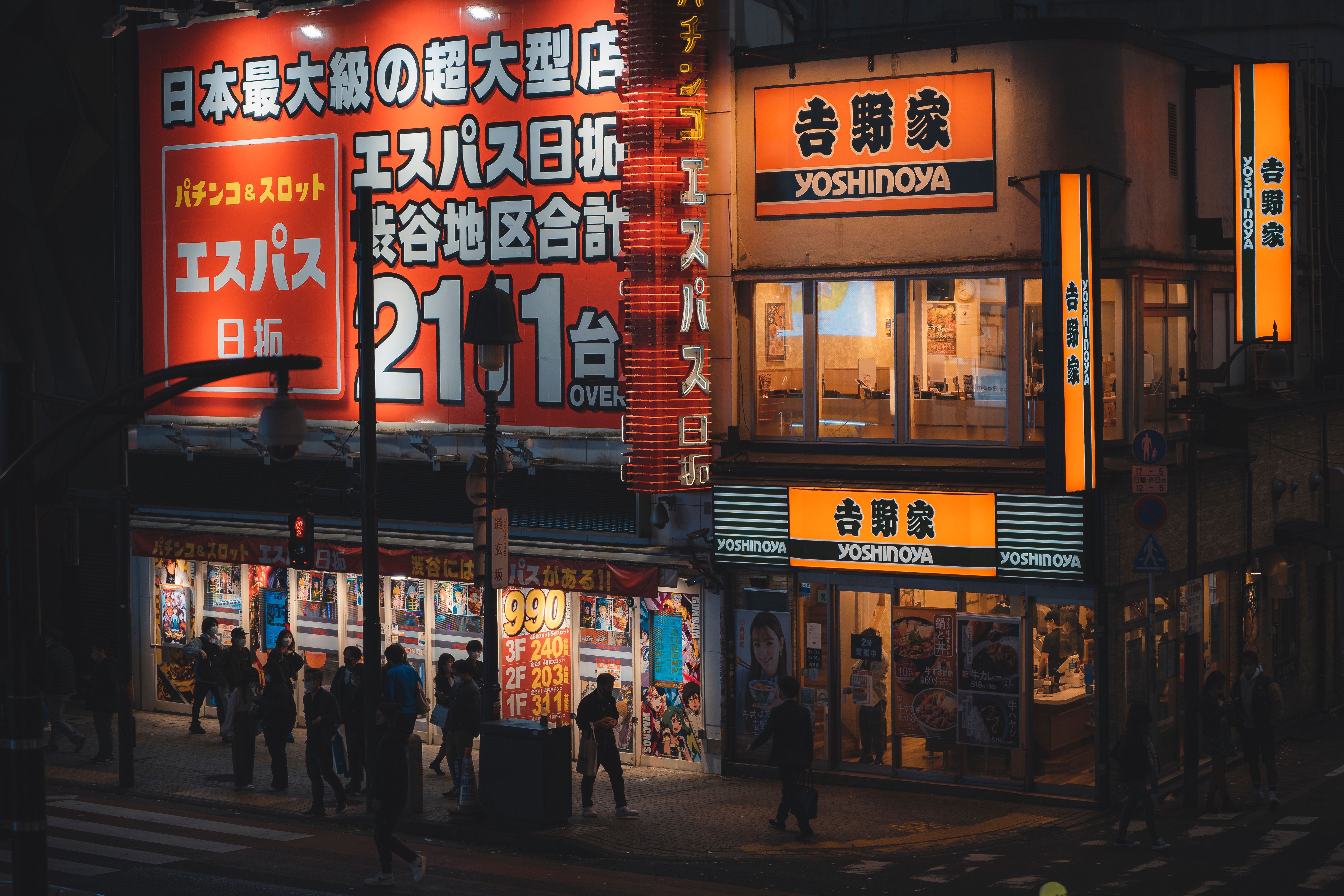 Captured in the city, this lively scene showcases illuminated signs and bustling nightlife. Captured in the city, this lively scene showcases illuminated signs and bustling nightlife.