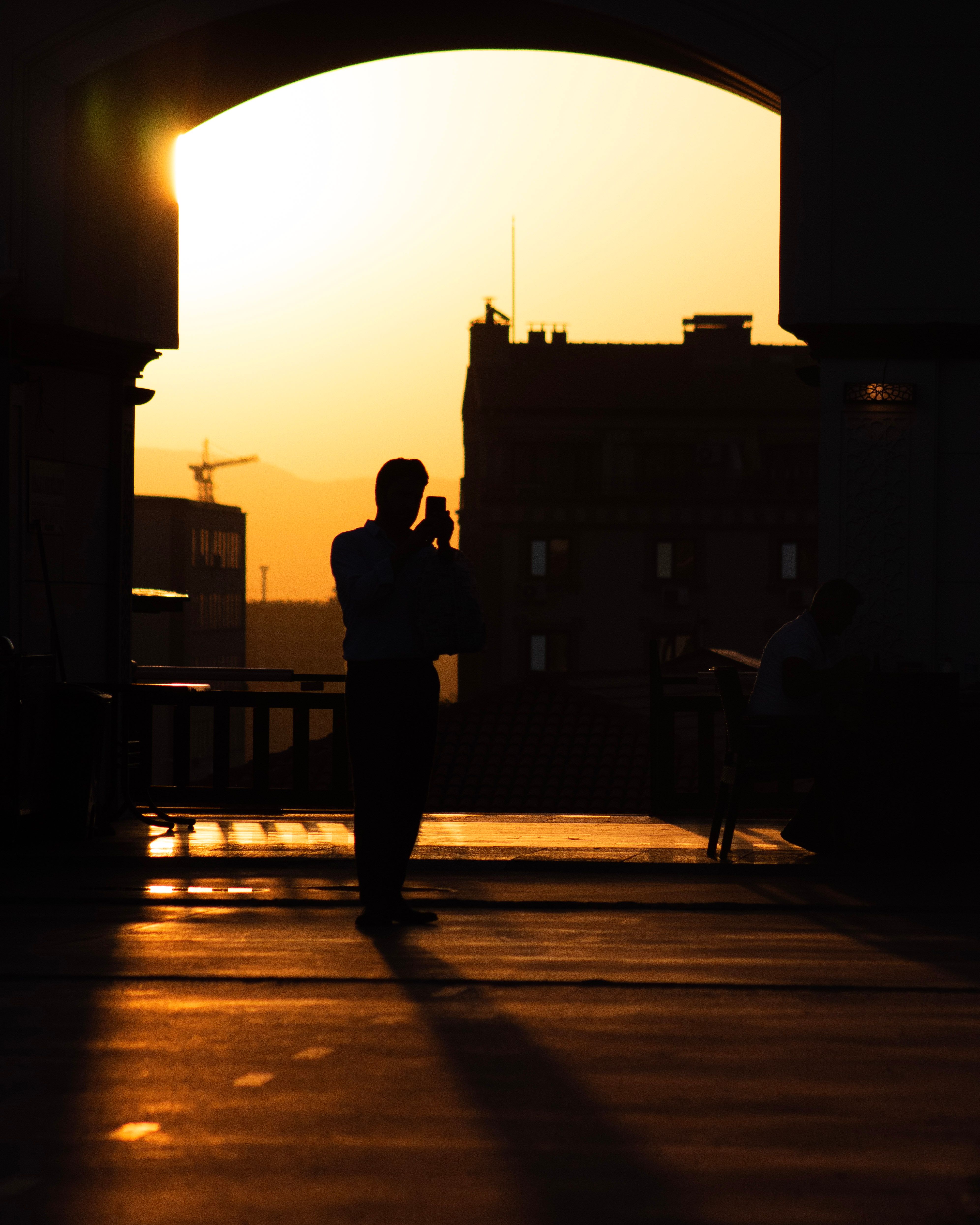 Silhouette of Man at Sunset · Free Stock Photo