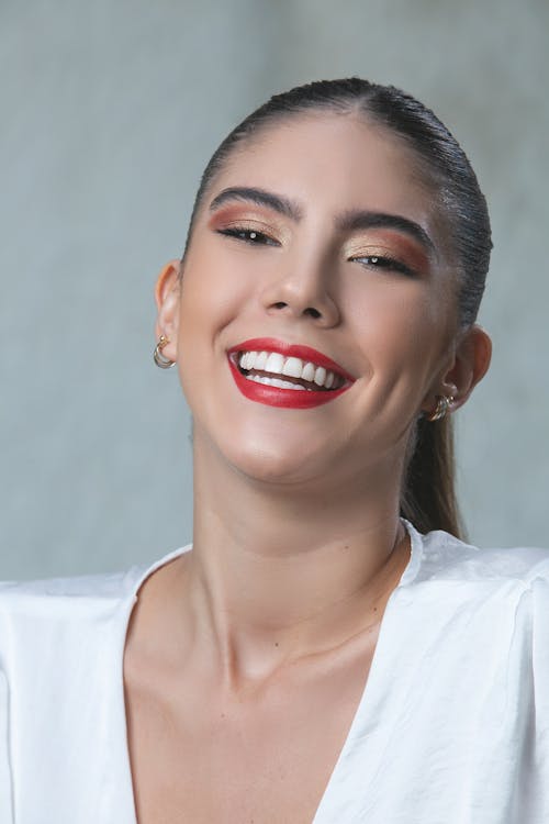 Portrait of a Young Woman Wearing Red Lipstick Smiling 