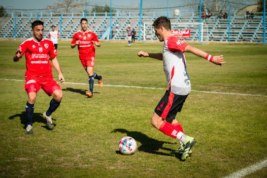 Players in action during a soccer match in Mendoza, Argentina, showcasing teamwork and athleticism.