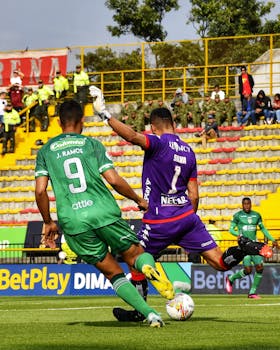 Players in action during a vibrant soccer match, showcasing skill and sportsmanship on the field.