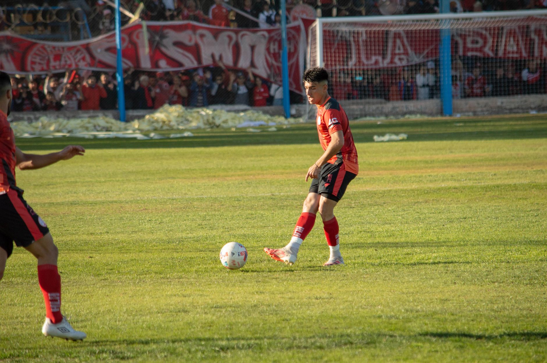 Houssem Aouar receiving the ball between midfield lines during an Algeria training session