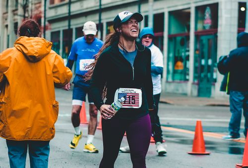 Free A woman runner triumphantly completes a marathon in Wheeling, WV. Stock Photo
