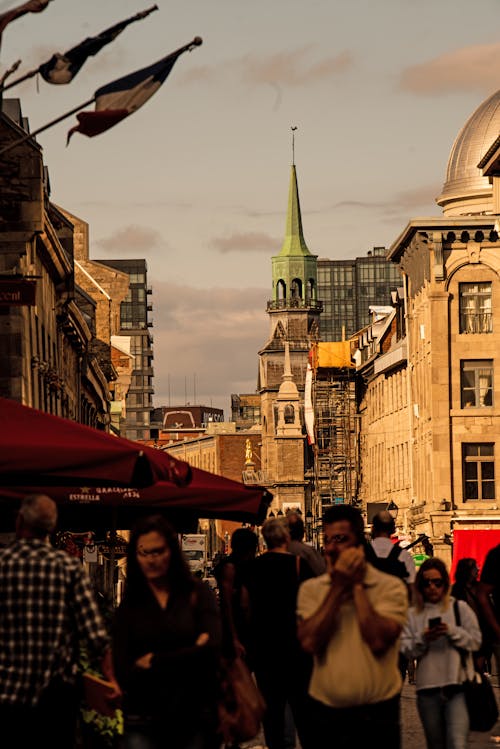 A Crowded City Street between Traditional Buildings 