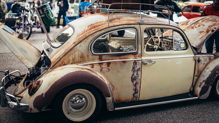 Rusty Volkswagen Beetle At Public Show