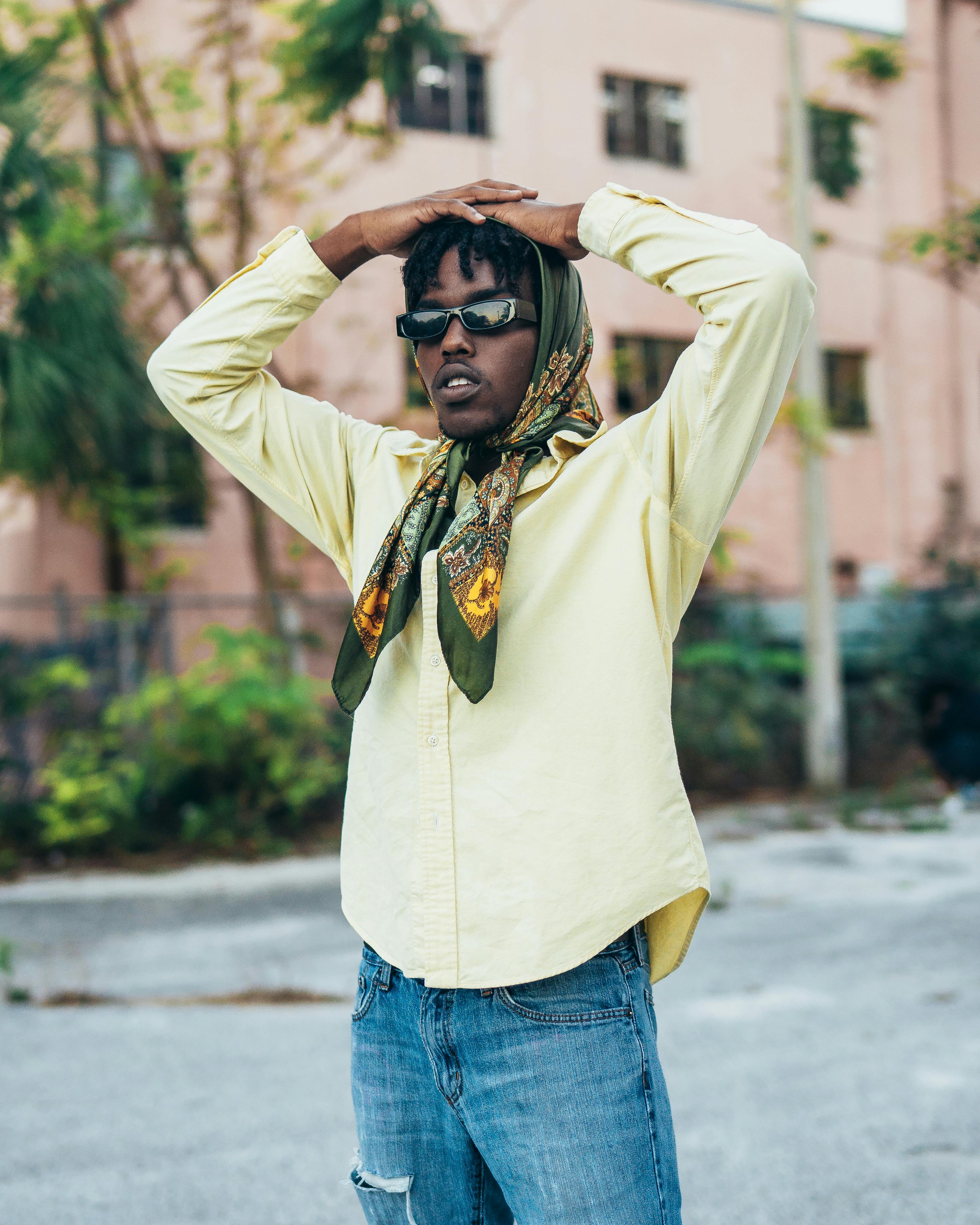 Man in Handkerchief and Sunglasses Posing on Street · Free Stock Photo