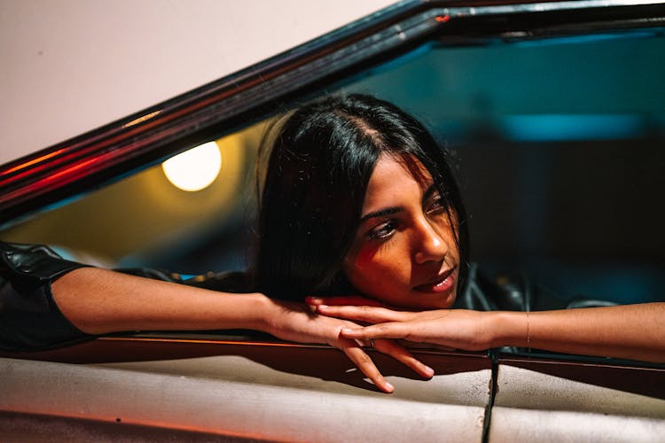 Woman Looking Out Of Car Window