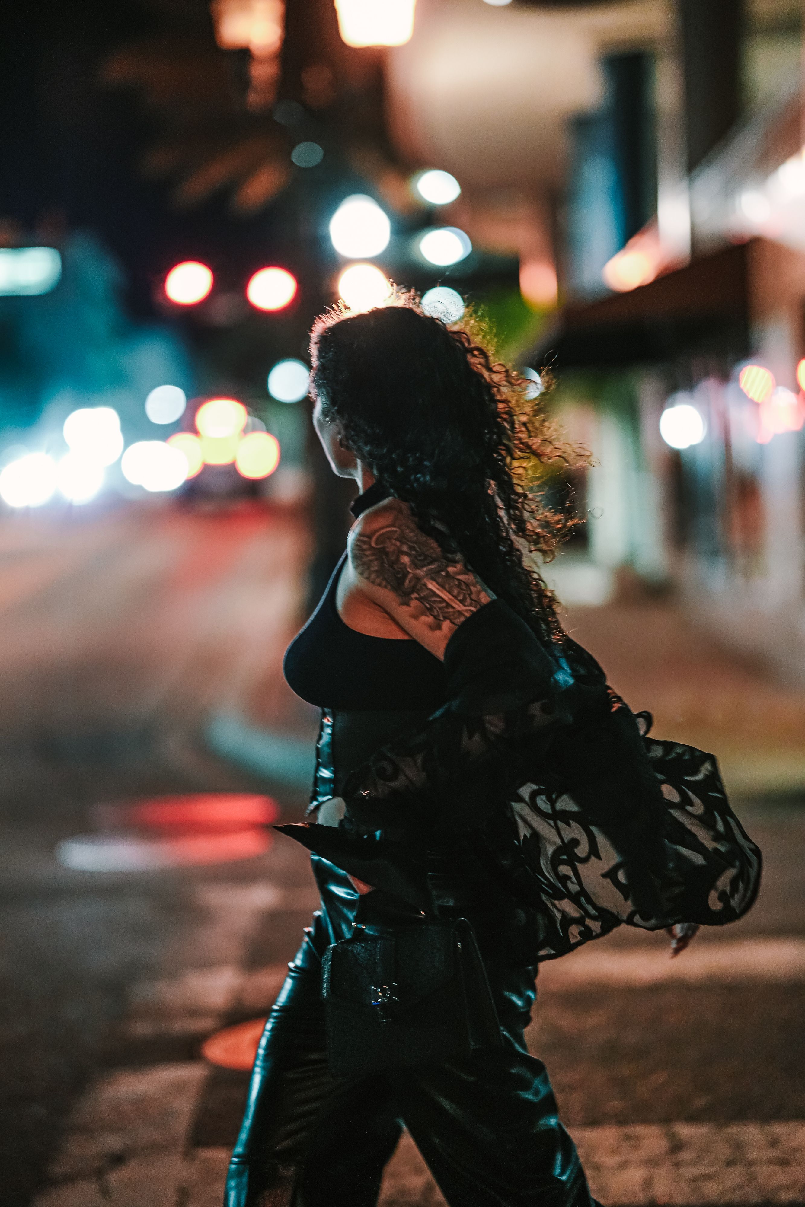 Woman with Tattoos Walking on Night Street · Free Stock Photo