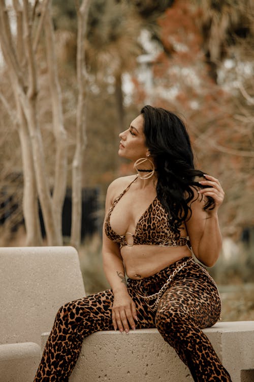 A woman in a leopard print top and pants