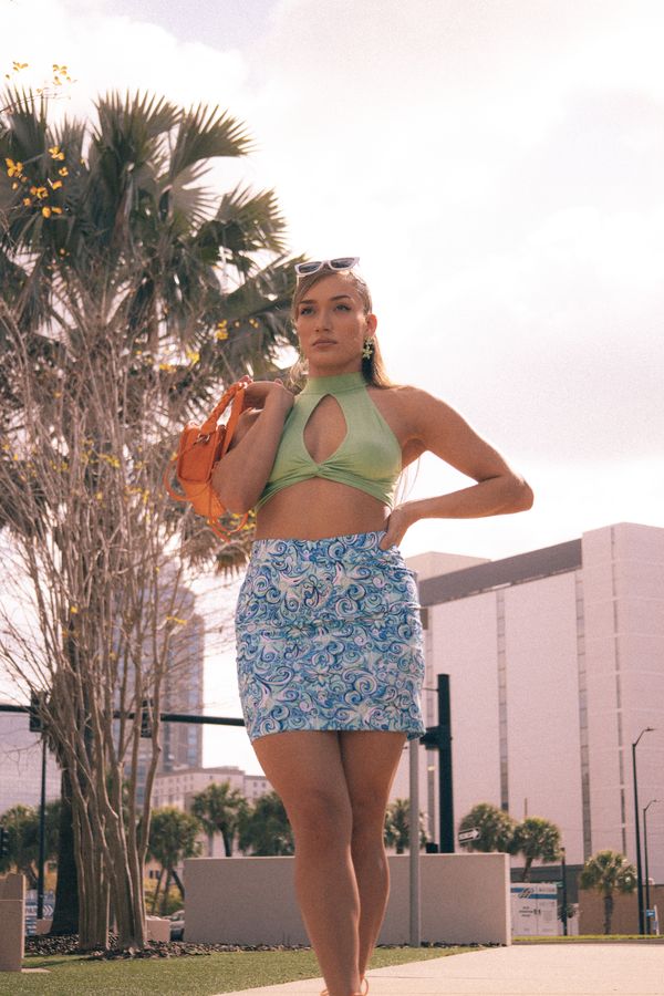 Woman in a sage green linen two-piece set