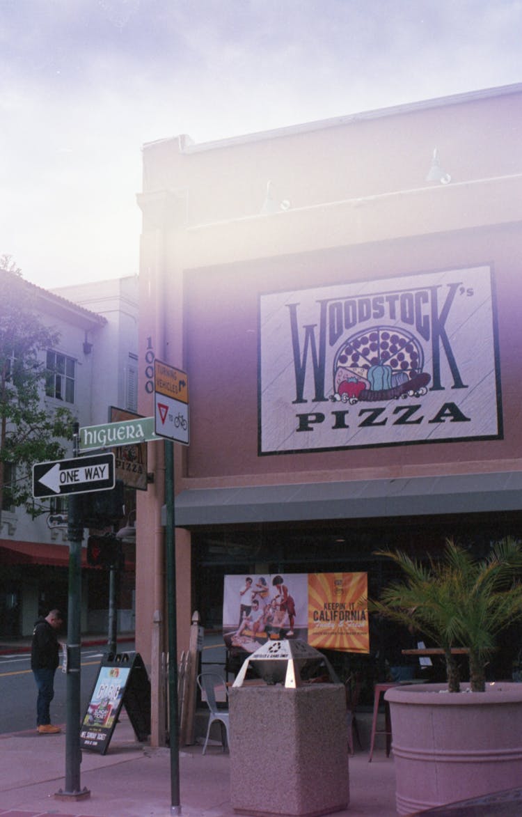 Woodstock Pizza Advertisement On Wall