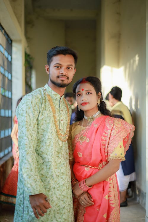 Couple Posing Together in Traditional Clothing