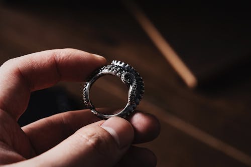 Close-up of Man Holding an Octopus Tentacle Ring