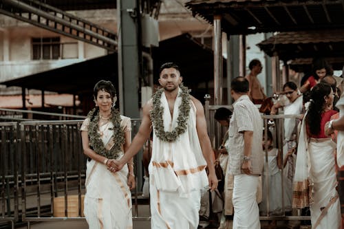 Couple in Traditional Clothing with Garlands