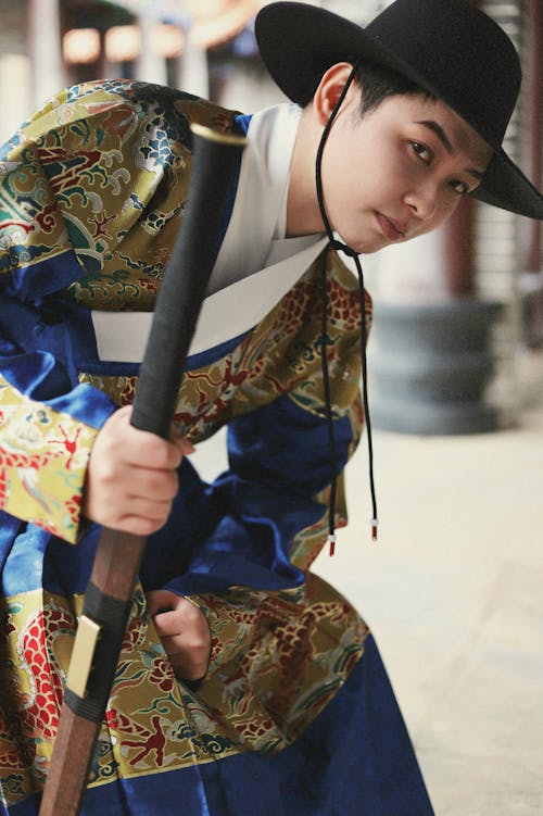 Man Wearing Hat and Traditional Japanese Costume