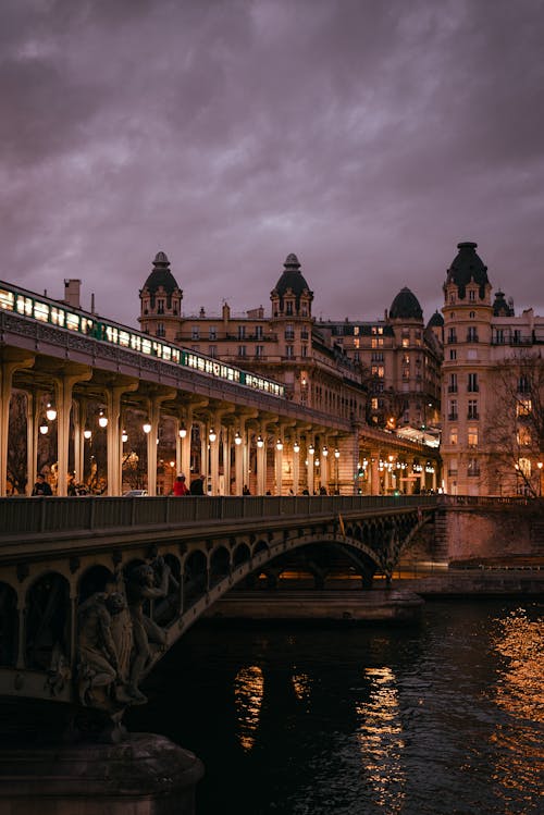 Paris at dusk with a bridge and buildings