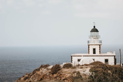 Free White Lighthouse On Cliff  Stock Photo