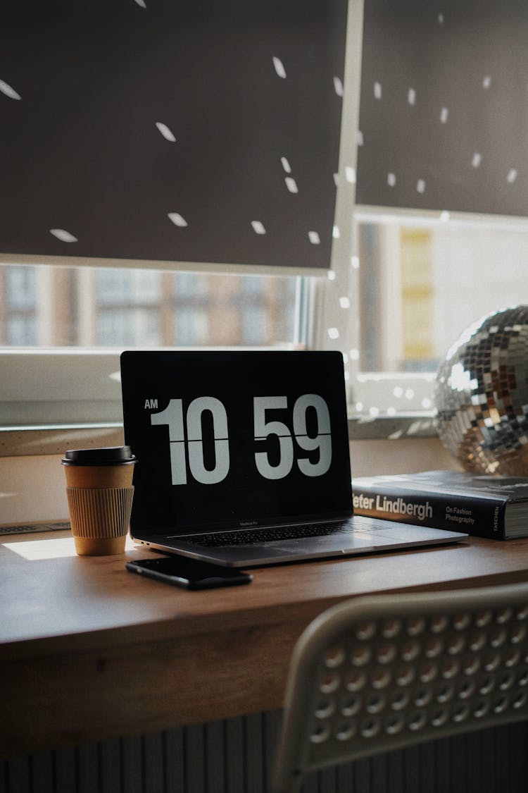 Laptop And Coffee On Desk In Home Office