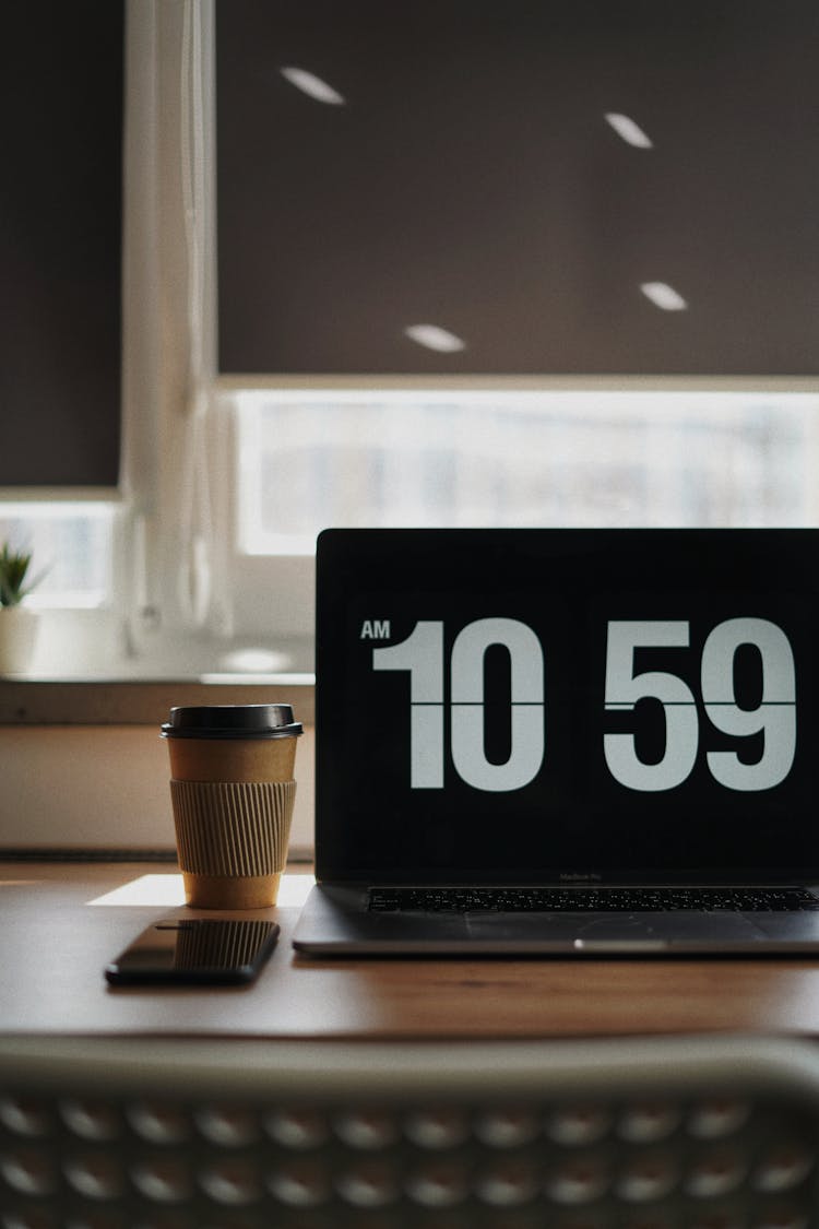 Laptop And Coffee On Desk In Home Office