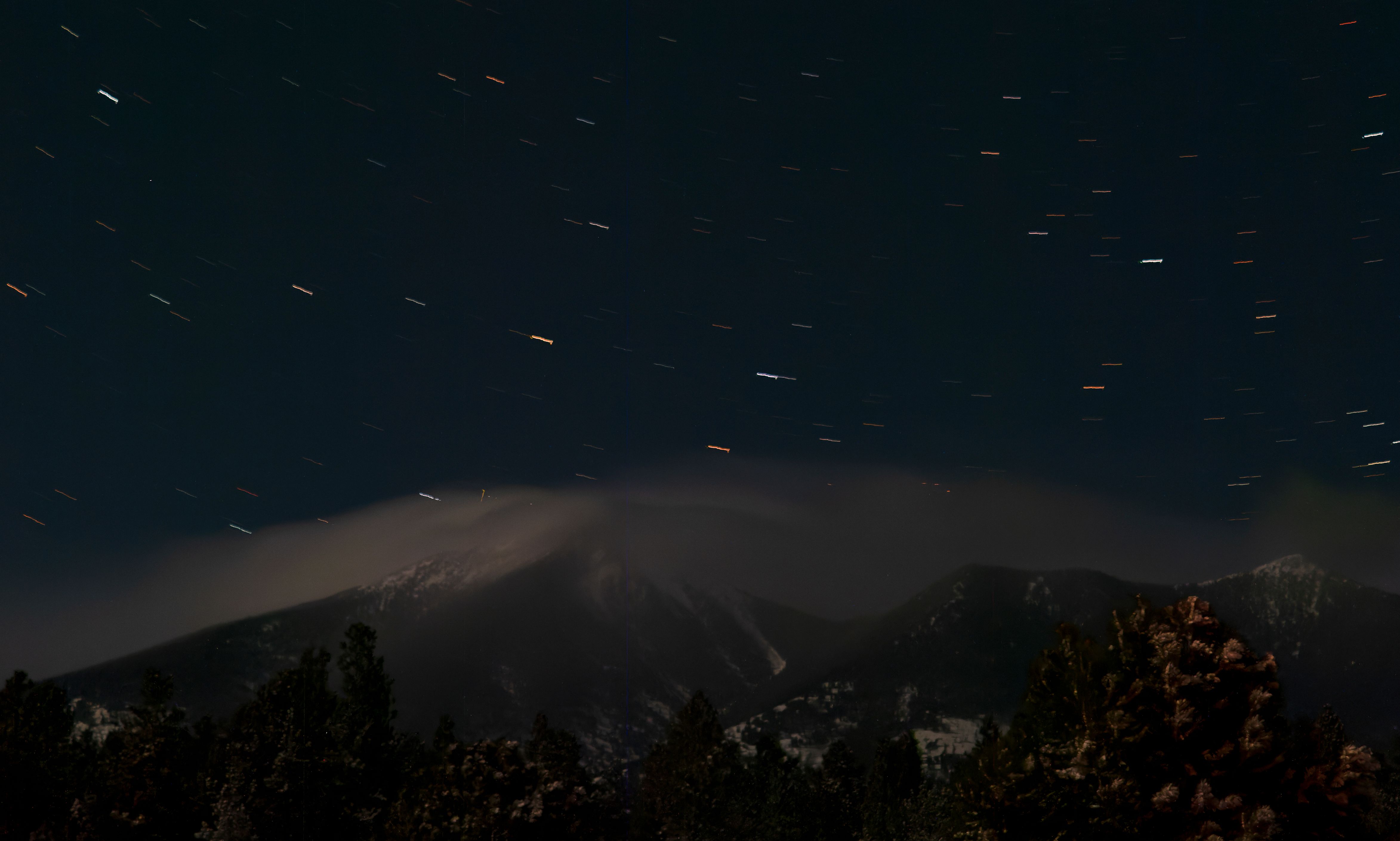 Star-filled night sky above the San Francisco Peaks in Flagstaff, Arizona