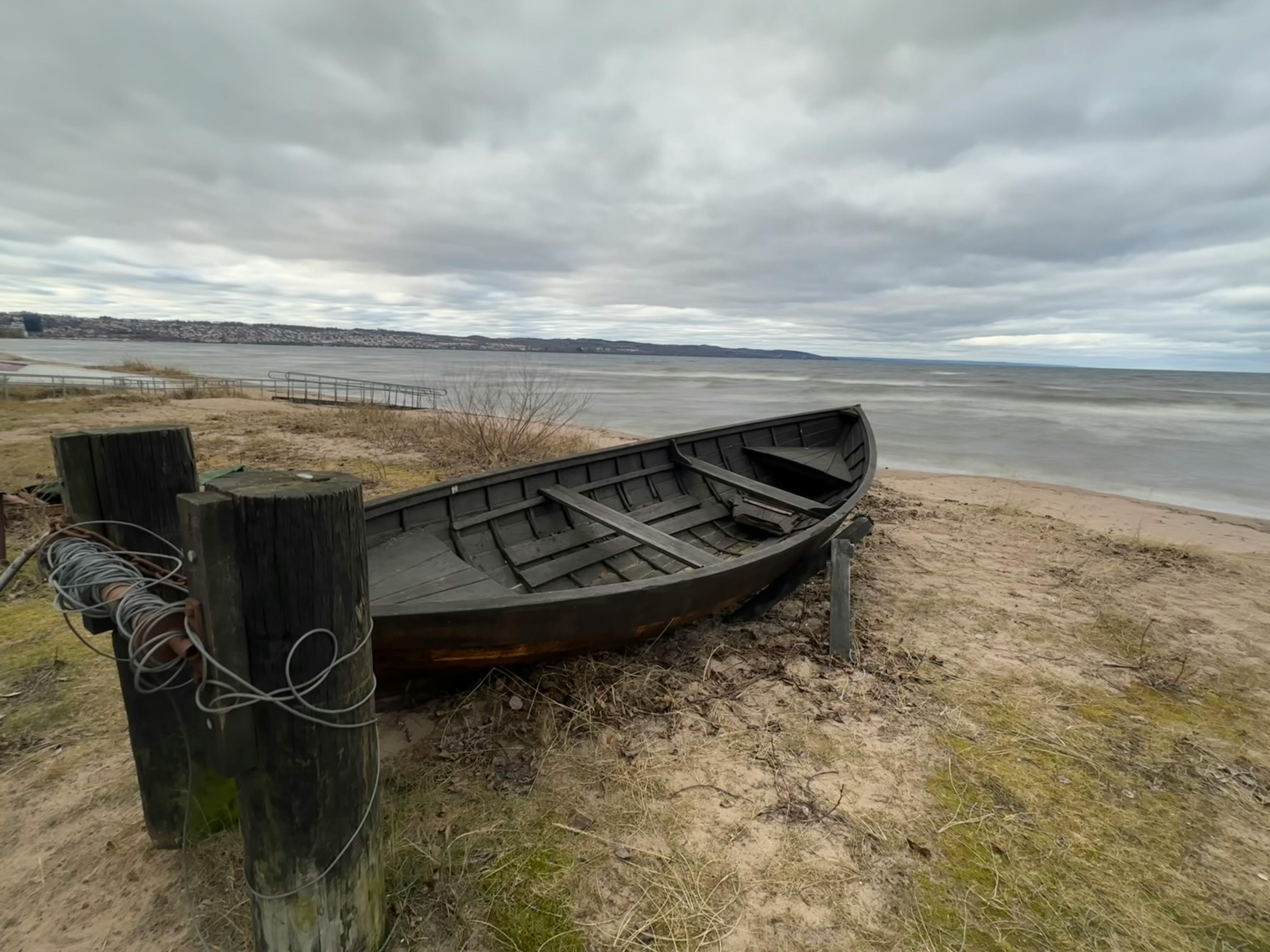 Old boat on beach near sea · Free Stock Photo