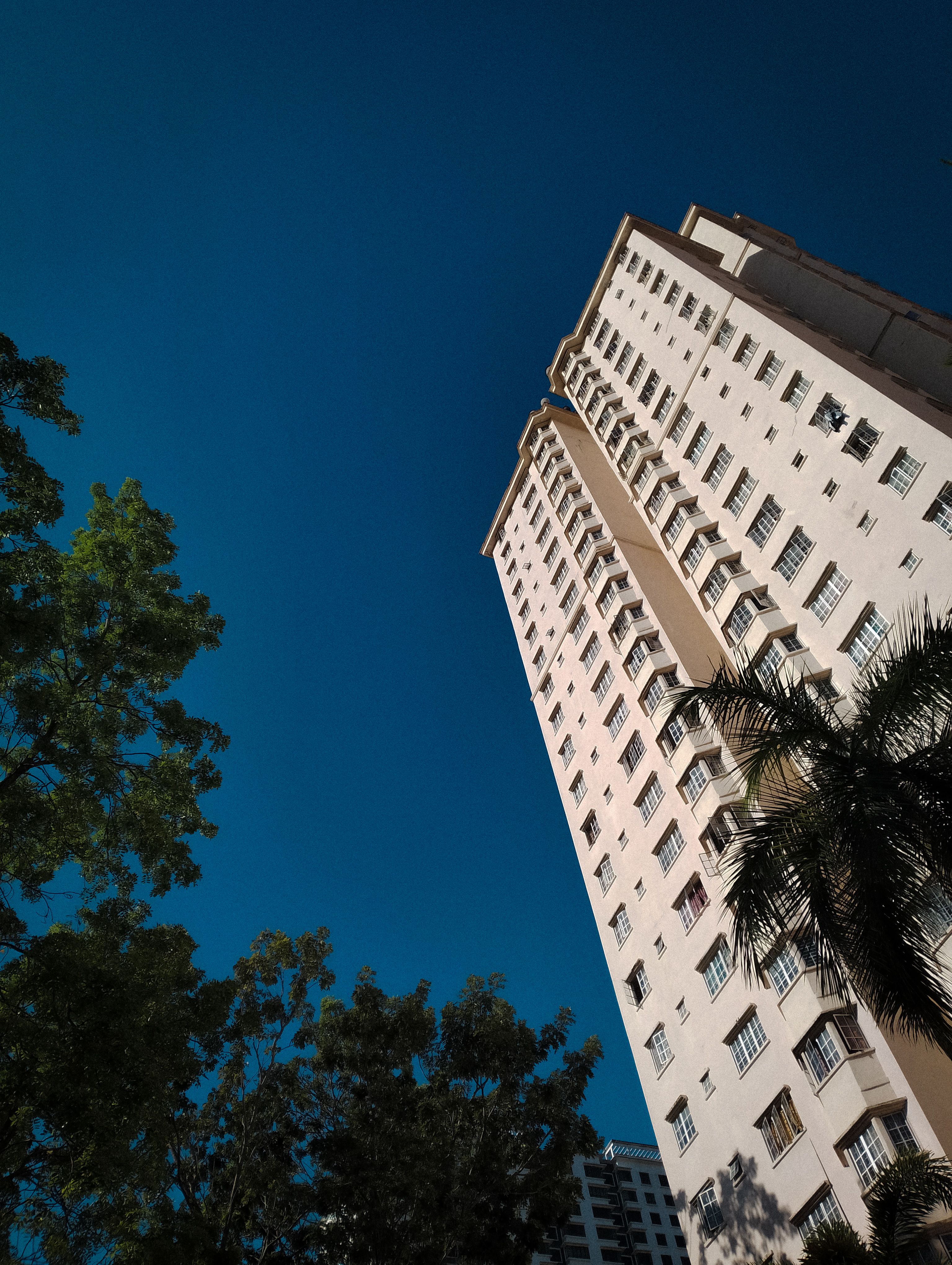 Low Angle Shot of a Modern Apartment Building under Blue Sky · Free ...