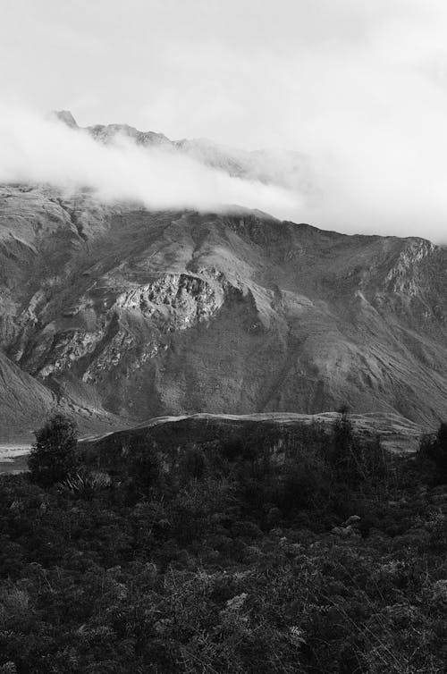 Black and White Picture of Mountains with Peaks above the Clouds 