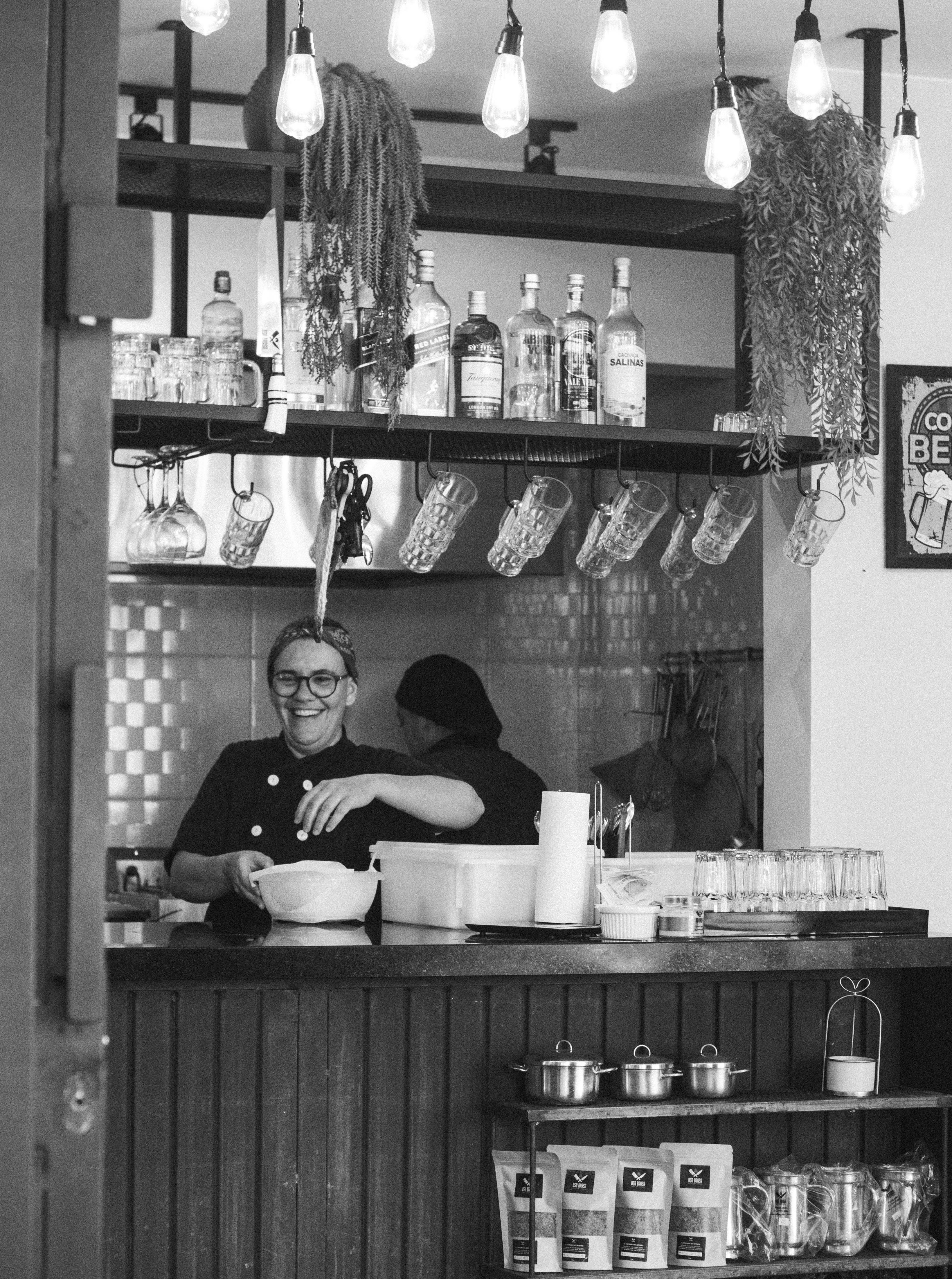 Two Women Working behind a Bar Counter · Free Stock Photo