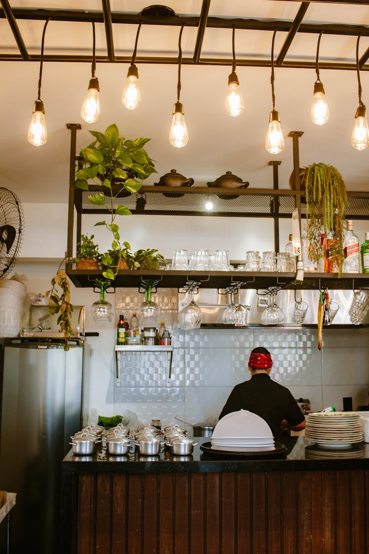 Chef Behind A Counter In A Bar 