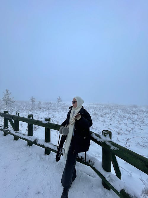 Woman Posing near Railing in Winter