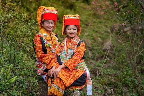 Women Posing in Traditional Clothing