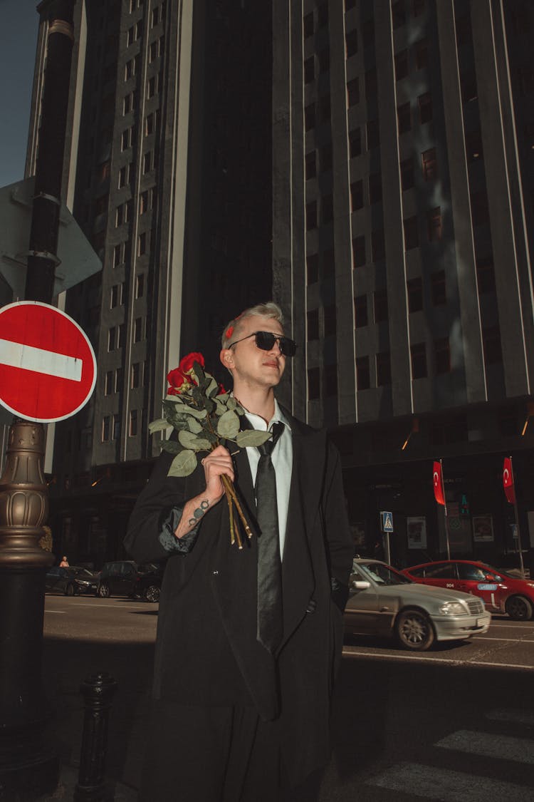 Man With Flowers On City Street