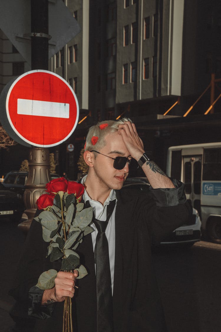 Man With Flowers On City Street