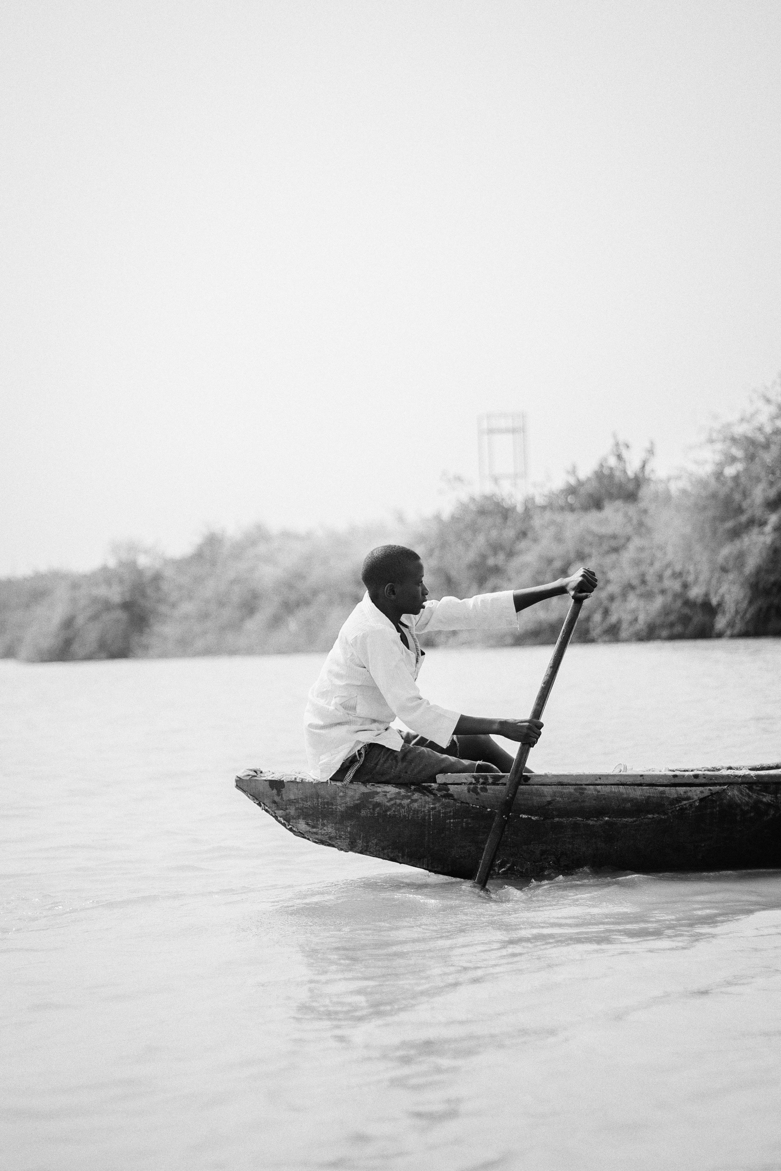 African Man On Water Boat Photos,