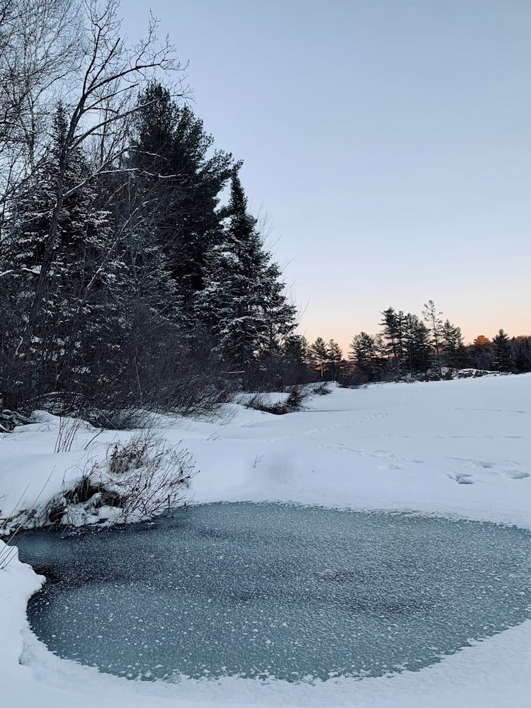 Frozen Lake Surface Covered In Snow